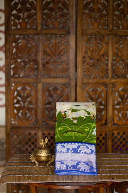 Leaf green crepe saree with pichwaI print