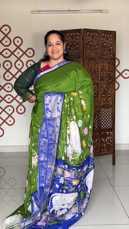 Leaf green crepe saree with pichwaI print