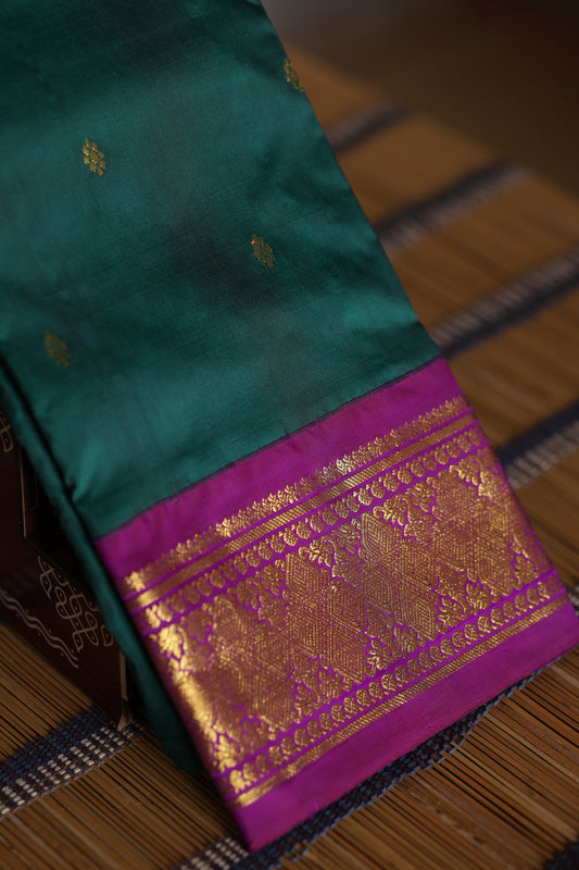 Bottle green with majenta border and pallu