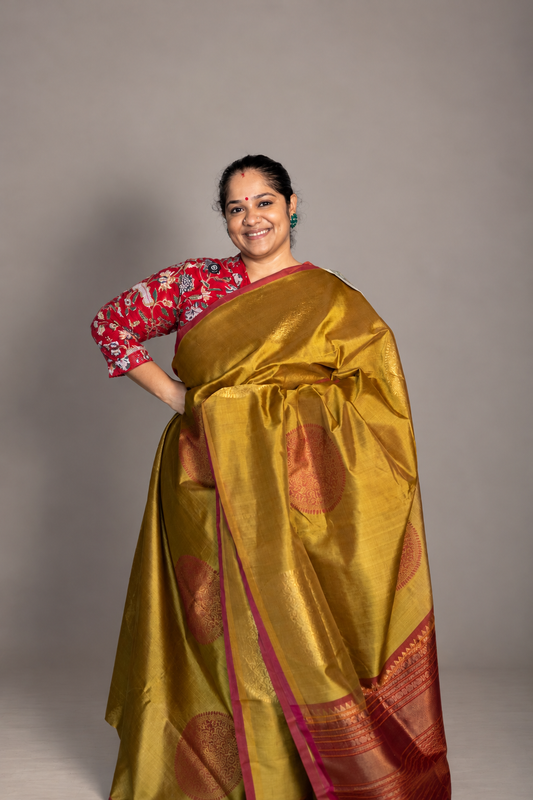 Vendhayam Golden colour with maroon pallu- big  chakram motifs