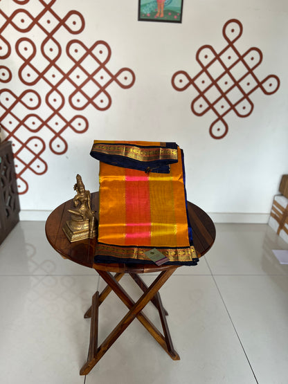Korvai  Multi coloured silk cotton- Orangish Pink, Sampangi Yellow, Turmeric Yellow with Navy blue border
