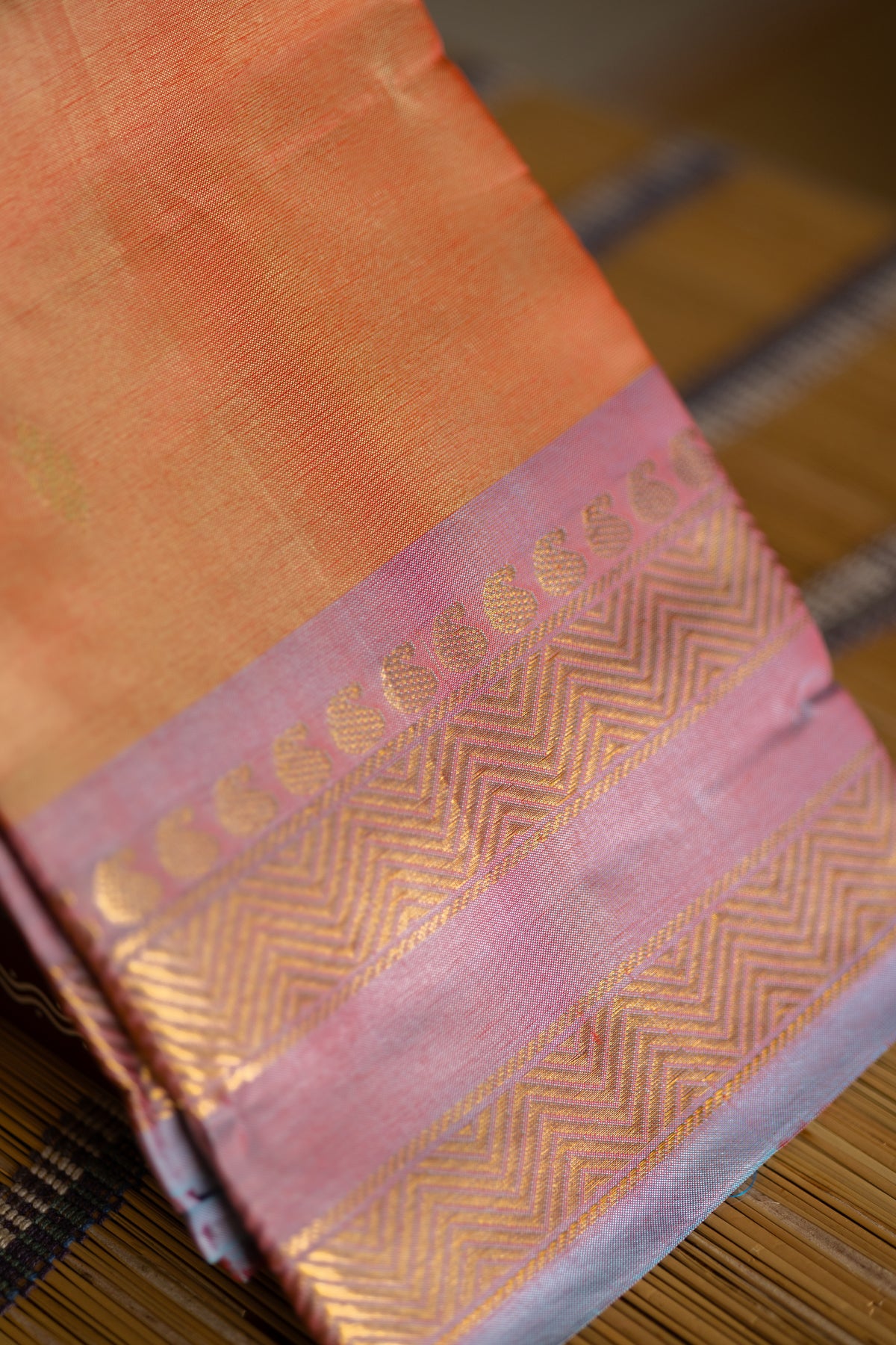 Orange Saree with Gold Zari Buttas & Sky Blue Pallu