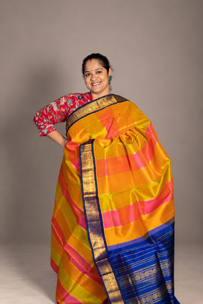 Korvai  Multi coloured silk cotton- Orangish Pink, Sampangi Yellow, Turmeric Yellow with Navy blue border
