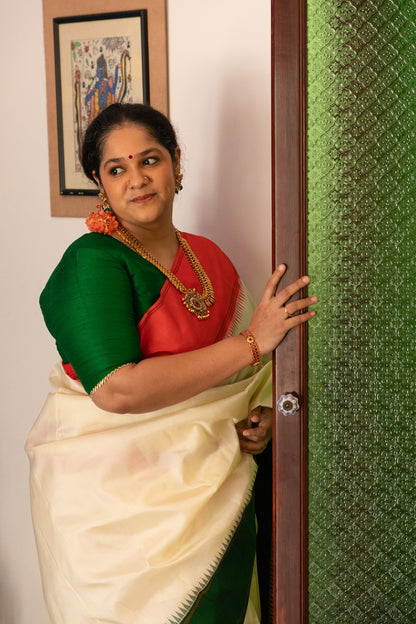 Half white with Orange and Green Ganga Jamuna Border (with Green Pallu)