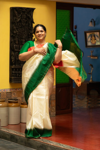 Half white with Orange and Green Ganga Jamuna Border (with Green Pallu)