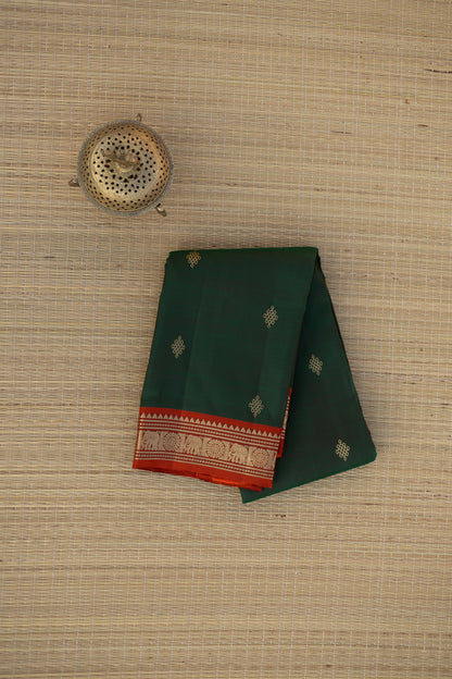 Green kolam saree with orange elephant border