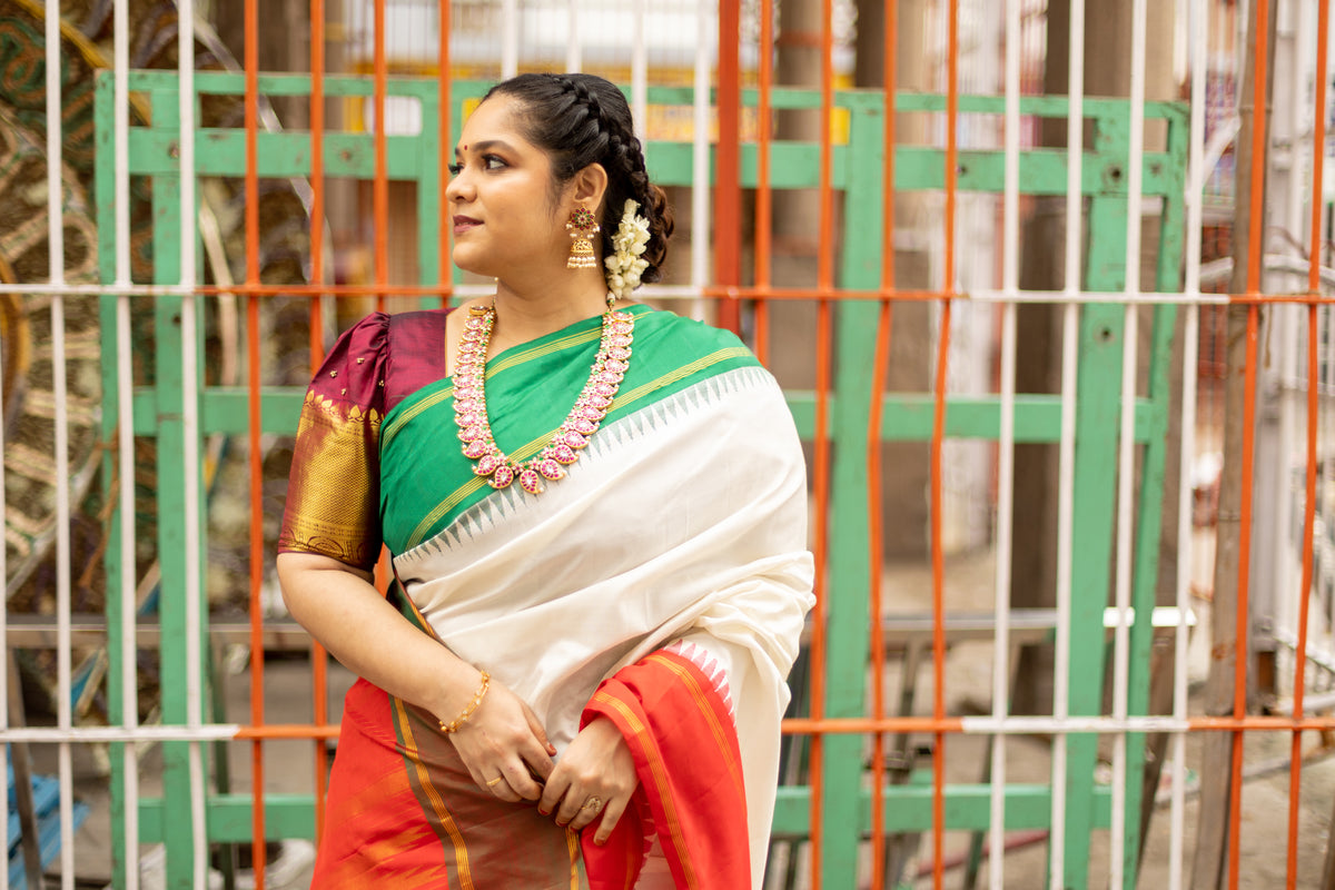Half white with Orange and Green Ganga Jamuna Border (with Red Pallu)
