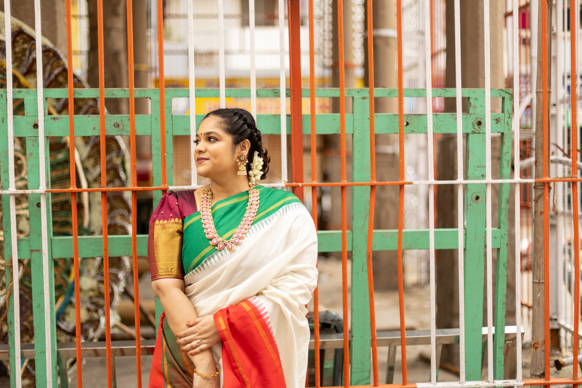 Half white with Orange and Green Ganga Jamuna Border (with Red Pallu)