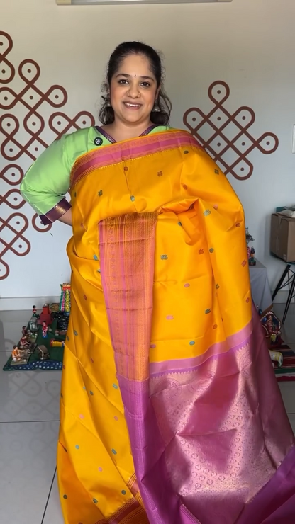 Turmeric Yellow with mauve pink thread work saree
