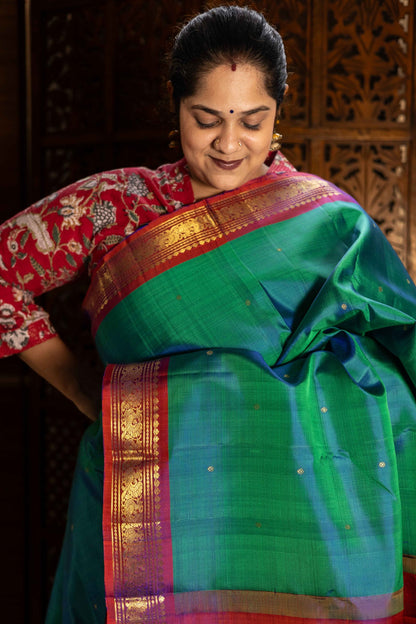 Mayil Kazhuthu Green with Orangish Pink Mayil Border (PREORDER)