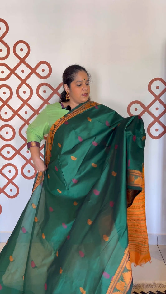 Meenakshi green with mustard peacock motifs thread border