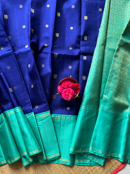 Navy blue with turquoise blue annam, chakram motifs with vaira oosi border