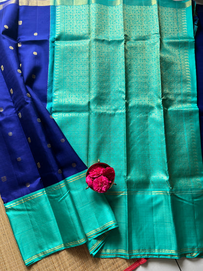 Navy blue with turquoise blue annam, chakram motifs with vaira oosi border