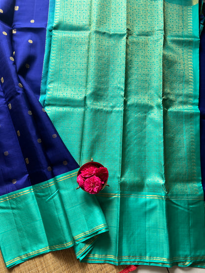 Navy blue with turquoise blue annam, chakram motifs with vaira oosi border