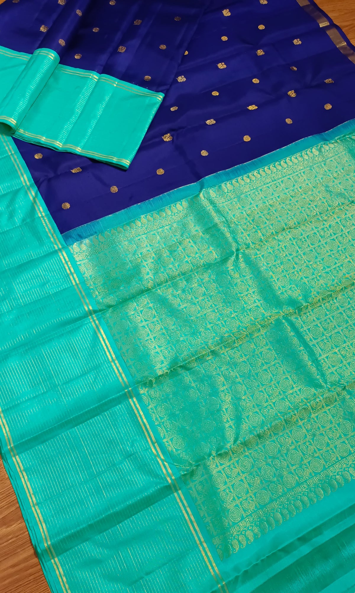 Navy blue with turquoise blue annam, chakram motifs with vaira oosi border