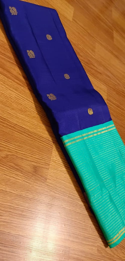 Navy blue with turquoise blue annam, chakram motifs with vaira oosi border