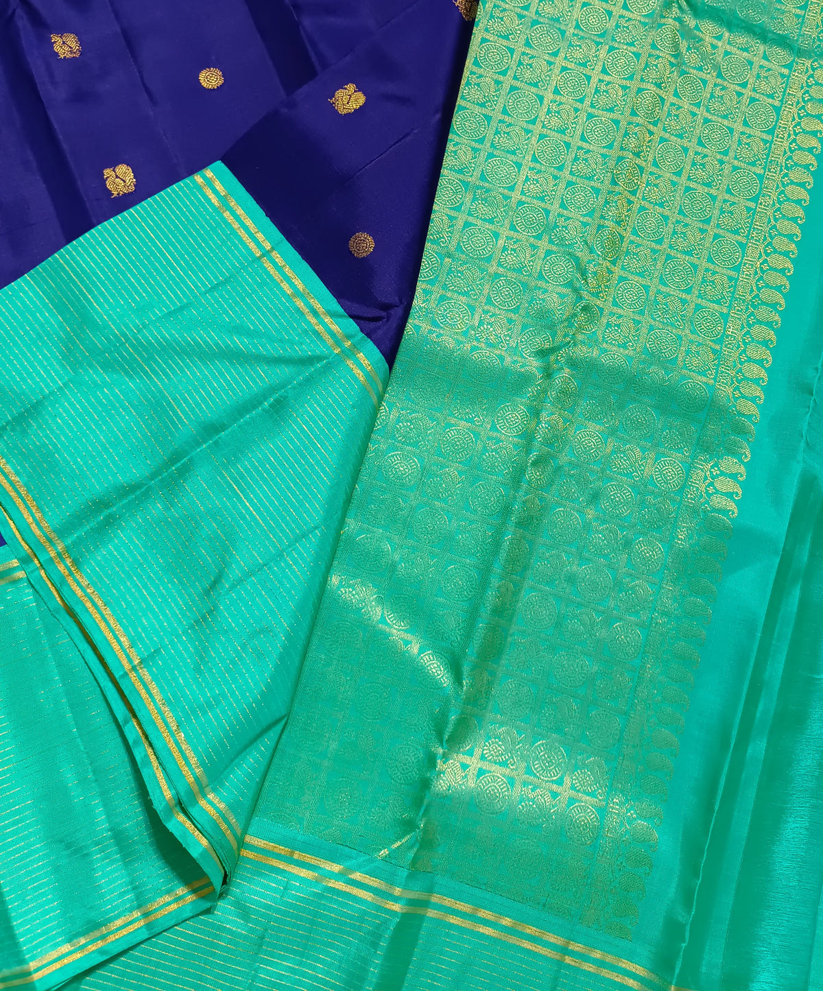Navy blue with turquoise blue annam, chakram motifs with vaira oosi border