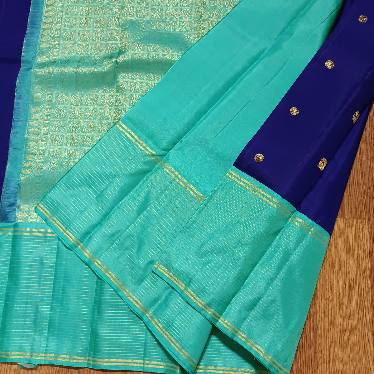 Navy blue with turquoise blue annam, chakram motifs with vaira oosi border