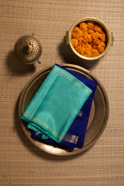 Navy blue with turquoise blue annam, chakram motifs with vaira oosi border