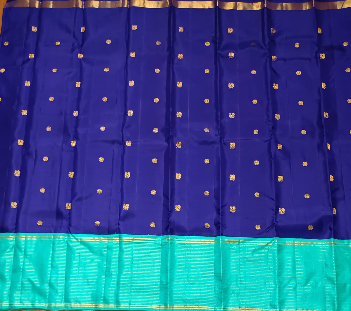 Navy blue with turquoise blue annam, chakram motifs with vaira oosi border