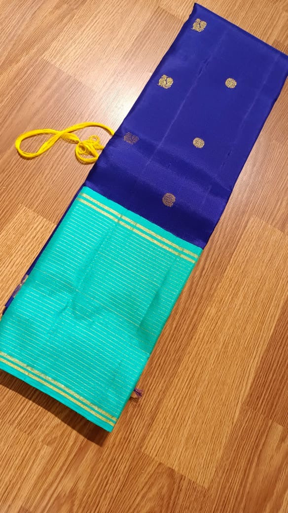 Navy blue with turquoise blue annam, chakram motifs with vaira oosi border