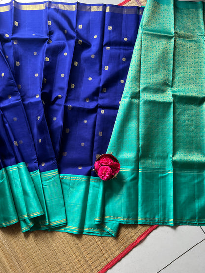 Navy blue with turquoise blue annam, chakram motifs with vaira oosi border