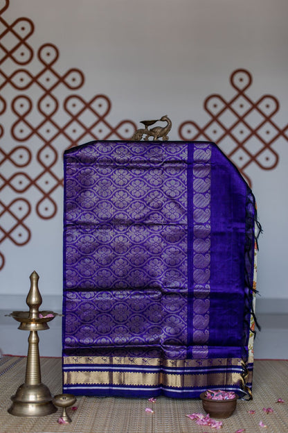 Cream with hand painted deep violet korvai border - Dancing motifs