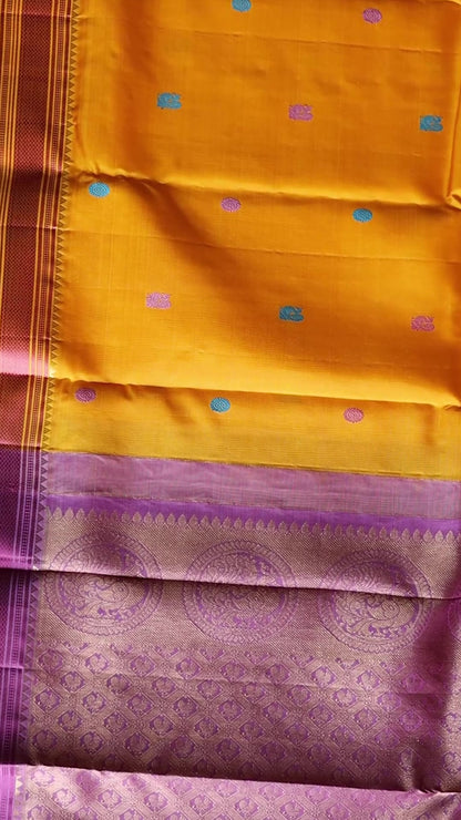 Turmeric Yellow with mauve pink thread work saree