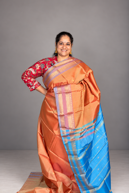 Orange Saree with Gold Zari Buttas & Sky Blue Pallu
