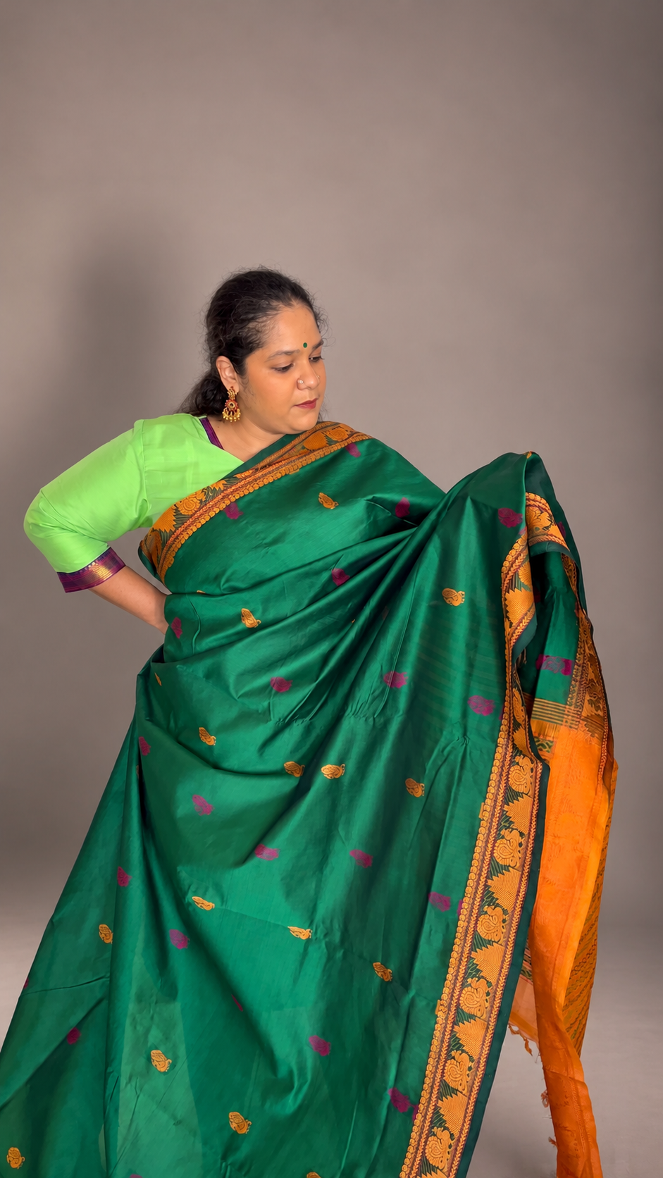 Meenakshi green with mustard peacock motifs thread border